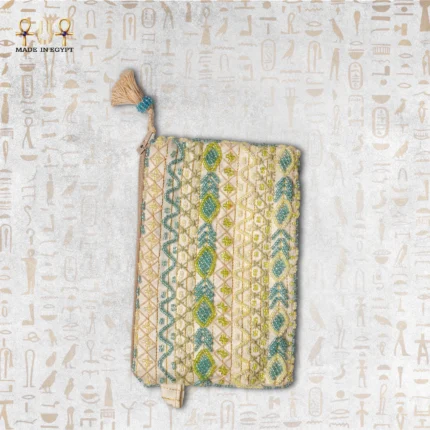 Top view of the "Turquoise Oasis" bag with turquoise, green, and golden beadwork and a tassel zipper pull.