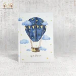 Illustrated blue hot air balloon notebook with clouds and stars, titled "Up in the Air".