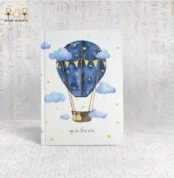 Illustrated blue hot air balloon notebook with clouds and stars, titled "Up in the Air".