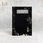 Elegant Winter Daily Agenda notebook with a minimalist black cover and subtle floral accents.