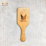 Back view of wooden hair brush engraved with Black Cat logo.