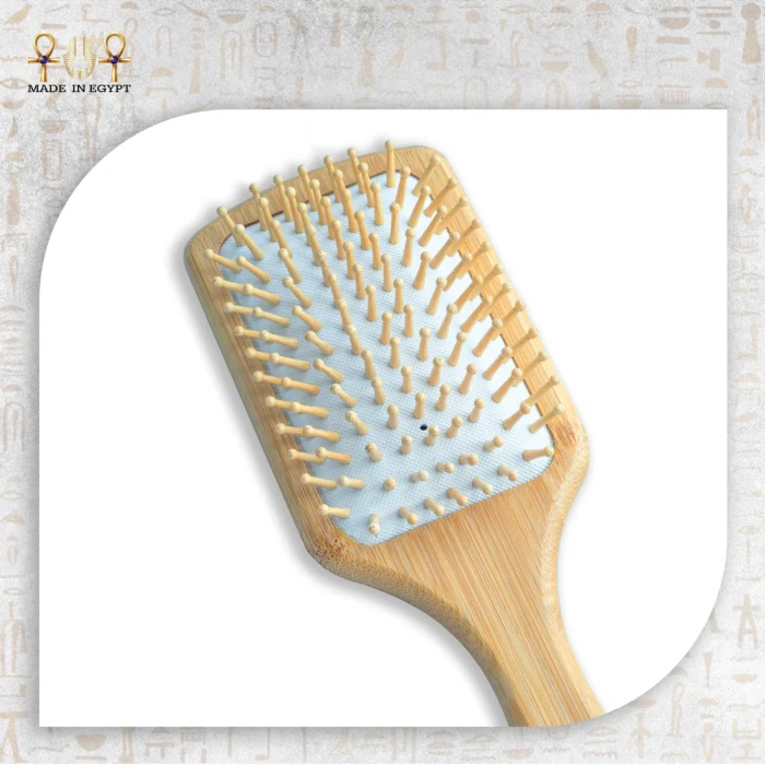 Close-up of wooden paddle brush bristles on white background.