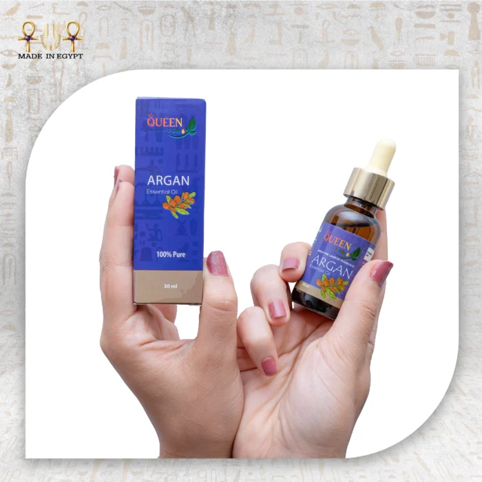 Argan Essential Oil, 30ml, bottle held with packaging box visible.