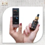 Black Seed Essential Oil, 30ml, bottle held with packaging box visible.