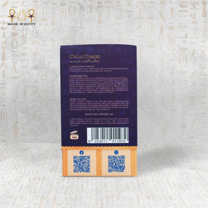 Detailed view of CairoCharm Hair Oil packaging, showing ingredients and usage instructions for dry hair treatment.