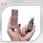 Castor Essential Oil, 30ml, bottle held with packaging box visible.
