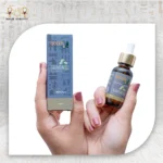 Chamomile Essential Oil, 30ml, bottle held with packaging box visible.