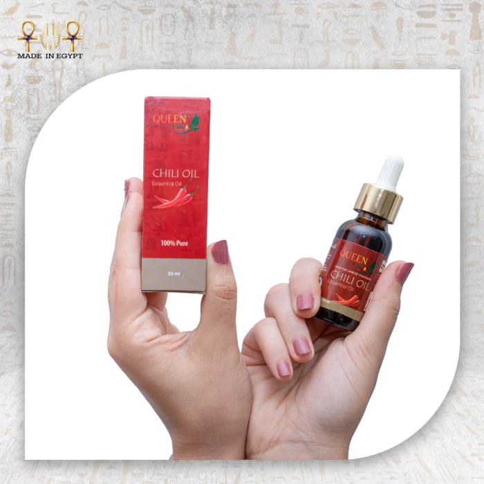 Chili Essential Oil, 30ml, bottle held with packaging box visible.