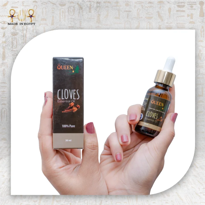 Cloves Essential Oil, 30ml, bottle held with packaging box visible.