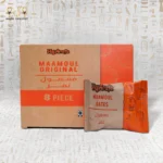 Front view of Haj Arafa Dates Secret Maamoul box with 8 pieces and a single wrapped maamoul biscuit in front.