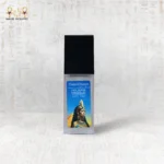 Close-up of CairoCharm Face Serum bottle with sleek design.