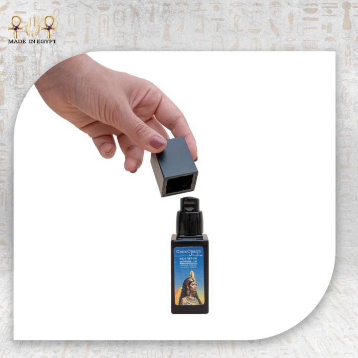 CairoCharm Hair Serum, 30ml, with cap being removed, showing product dispenser.
