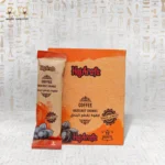 Front view of Hazelnut Delight instant coffee with hazelnut chunks, showing sachet and 12-sachet box.