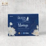 Front view of Queen Tiye's Moringa Natural Handmade Soap packaging (100g), with a blue box design.
