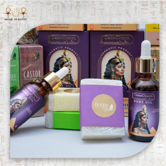 Assorted Queen Tiye products, including Chili Oil, Tea Tree Oil, Castor Oil, Ginger Oil, and CairoCharm Body Oil with soaps.