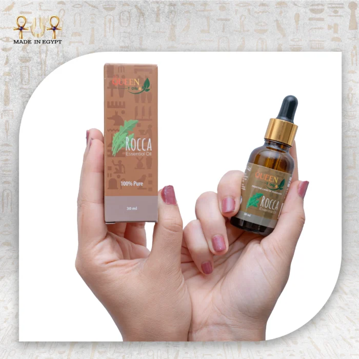 Rocca Essential Oil 100% Pure, 30 ml, with packaging, held in hand.