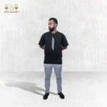 The Skyline Tee in black showcases a striking vertical white graphic on the front, adding a modern touch to its classic design. Made from premium cotton, it offers comfort, breathability, and a stylish fit for everyday wear.