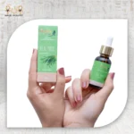 Queen Tea Tree Essential Oil 30ml bottle and packaging box, held in hands.