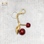 Glossy Cherry Keychain with Gold Details